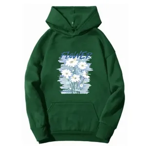 Close-up of deep green hoodie with white daisy flowers and FLOWER text detail