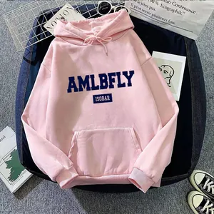 Pink oversized hoodie with blue AMLBFLY lettering and kangaroo pocket in a flat lay view