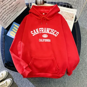 Detail view of red San Francisco hoodie with vintage white text and kangaroo pocket