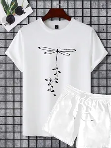 Detail of white cotton summer set showing dragonfly print T-shirt and drawstring shorts