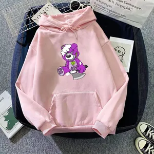 Detail of pink oversized hoodie featuring a purple zombie bear print with street accessories
