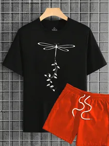 Detail view of black t-shirt with dragonfly print and orange shorts with drawstrings