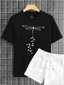Detail of black cotton T-shirt with dragonfly print and white drawstring shorts set