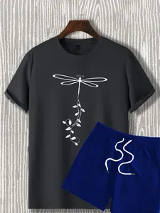 Detail of grey t-shirt with white dragonfly print and royal blue drawstring shorts