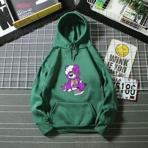 Detail of dark green oversized hoodie featuring a cartoon bear print and front kangaroo pocket
