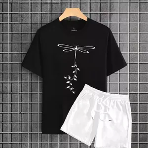 Men's two-piece set featuring black printed t-shirt and white shorts on industrial background