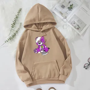 Flat lay of khaki oversize hoodie with purple cartoon bear graphic and kangaroo pocket
