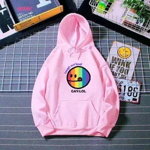 Close-up of pink hoodie featuring a rainbow smile face and Laugh out loud printed text