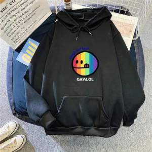 Detailed flat lay of black hoodie featuring rainbow smile print and front pocket pouch