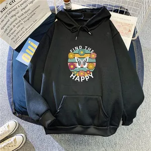 Close-up of black oversized hoodie featuring a butterfly and daisy print with kangaroo pocket