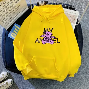 Flat lay of a yellow oversized hoodie with graffiti bear print and kangaroo pocket