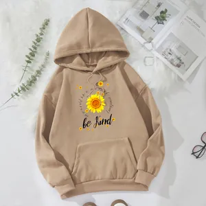 Detail of camel oversized hoodie with sunflower print and kangaroo pocket texture