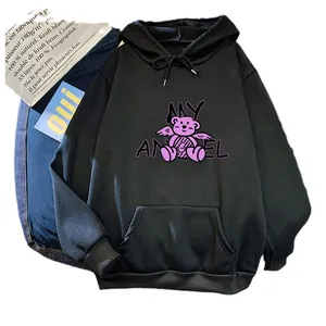 Oversized black hoodie for women featuring a pink cartoon angel bear graphic print