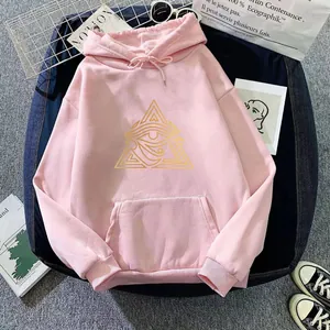 Detail of pink oversized hoodie showing golden geometric eye print and drawstring hood