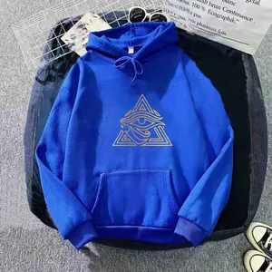 Detail of royal blue hoodie showing golden eye of Horus graphics and kangaroo pocket texture