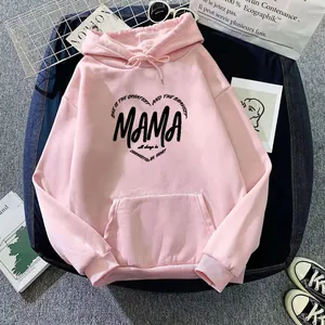 Close-up of pink oversized hoodie showing MAMA heart print and soft cotton texture