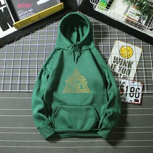 Detailed view of forest green hoodie featuring a golden eye print and drawstring hood