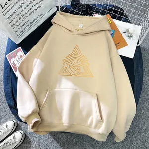Macro shot of khaki oversized hoodie featuring golden eye print and ribbed cuffs