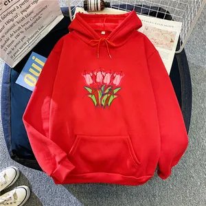 Flat lay of red oversized hoodie with tulip illustration and kangaroo pocket detail