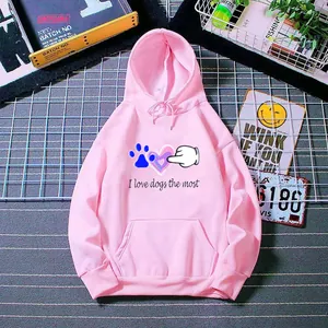Detail of pink hooded sweatshirt featuring I love dogs text and dog paw heart prints