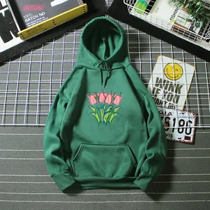 Detail of forest green oversized hoodie with pink tulip graphic and kangaroo pocket