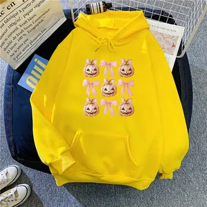 Bright yellow hooded sweatshirt with pink pumpkin and bow print for women in casual style