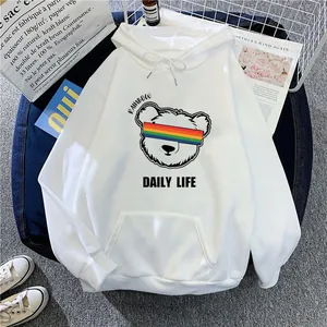Detail of white oversized hoodie featuring a bear print with rainbow glasses and drawstrings