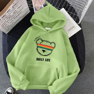 Close-up of light green hoodie featuring a rainbow bear graphic and kangaroo pocket