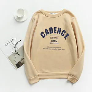 Detailed view of the ribbed crewneck and navy blue letter print on yellow sweatshirt