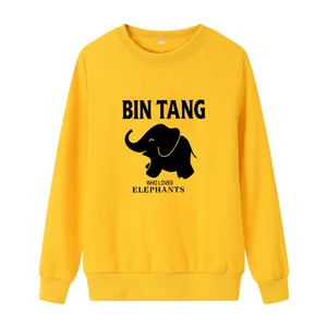 Yellow long sleeve crewneck sweatshirt featuring a black elephant print and graphic text
