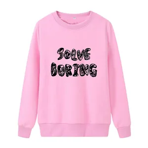 Detail of pink crewneck sweatshirt featuring Solve Boring graffiti print and ribbed cuffs