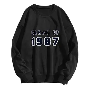 Close-up of Class of 1987 printed lettering on a black cotton crewneck sweatshirt