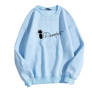 Close-up of sky blue crewneck sweatshirt featuring a black cat and Purrfect print