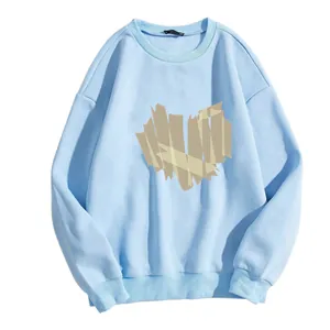 Detail of light blue crewneck sweatshirt featuring unique heart-shaped tape print design