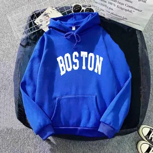 Detail of blue oversized hoodie with white BOSTON lettering and kangaroo pocket