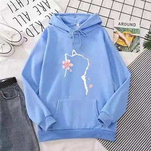 Detail view of light blue oversized hoodie featuring a cat and cherry blossom graphic print