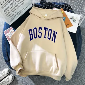 Detail of apricot Boston hoodie with ribbed cuffs and large kangaroo pocket design
