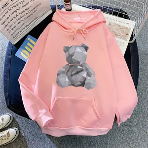 Detail of light pink hoodie featuring a geometric bear print and front kangaroo pocket