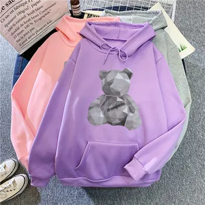 Flat lay of hoodies in purple, pink, and grey with geometric teddy bear print and pocket