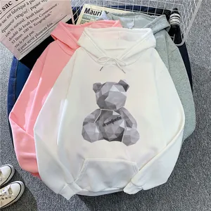Flat lay of colorful hoodies featuring a geometric teddy bear print and kangaroo pockets