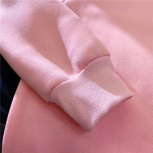 Detailed macro view of soft pink cotton sweatshirt ribbed cuffs with high quality texture