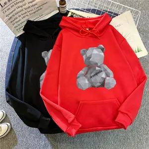 Detailed flat lay of oversized hoodies with geometric bear print and rib-knit cuffs