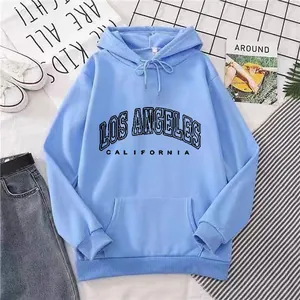 Detail of light blue Los Angeles hoodie showing drawstring hood and kangaroo pocket texture