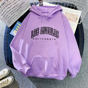 Flat lay of purple loose hoodie with Los Angeles California print and streetwear decor