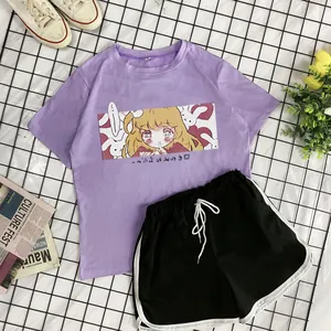 Flat lay of purple short-sleeve T-shirt with anime print and black drawstring shorts set