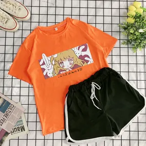 Women's summer sports set with orange cartoon t-shirt and dark green athletic shorts