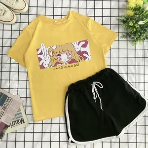 Flat lay of summer yellow cartoon T-shirt and black side-striped shorts set