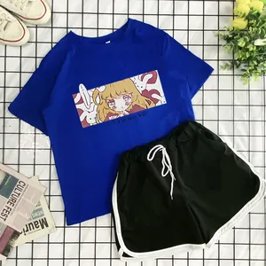 Detail of royal blue T-shirt with anime print and black shorts with white drawstrings
