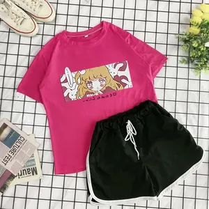 Detail of pink summer t-shirt with anime print and black drawstring sports shorts