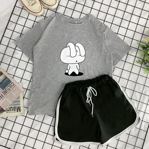Flat lay of gray rabbit print T-shirt and black shorts with white contrast binding